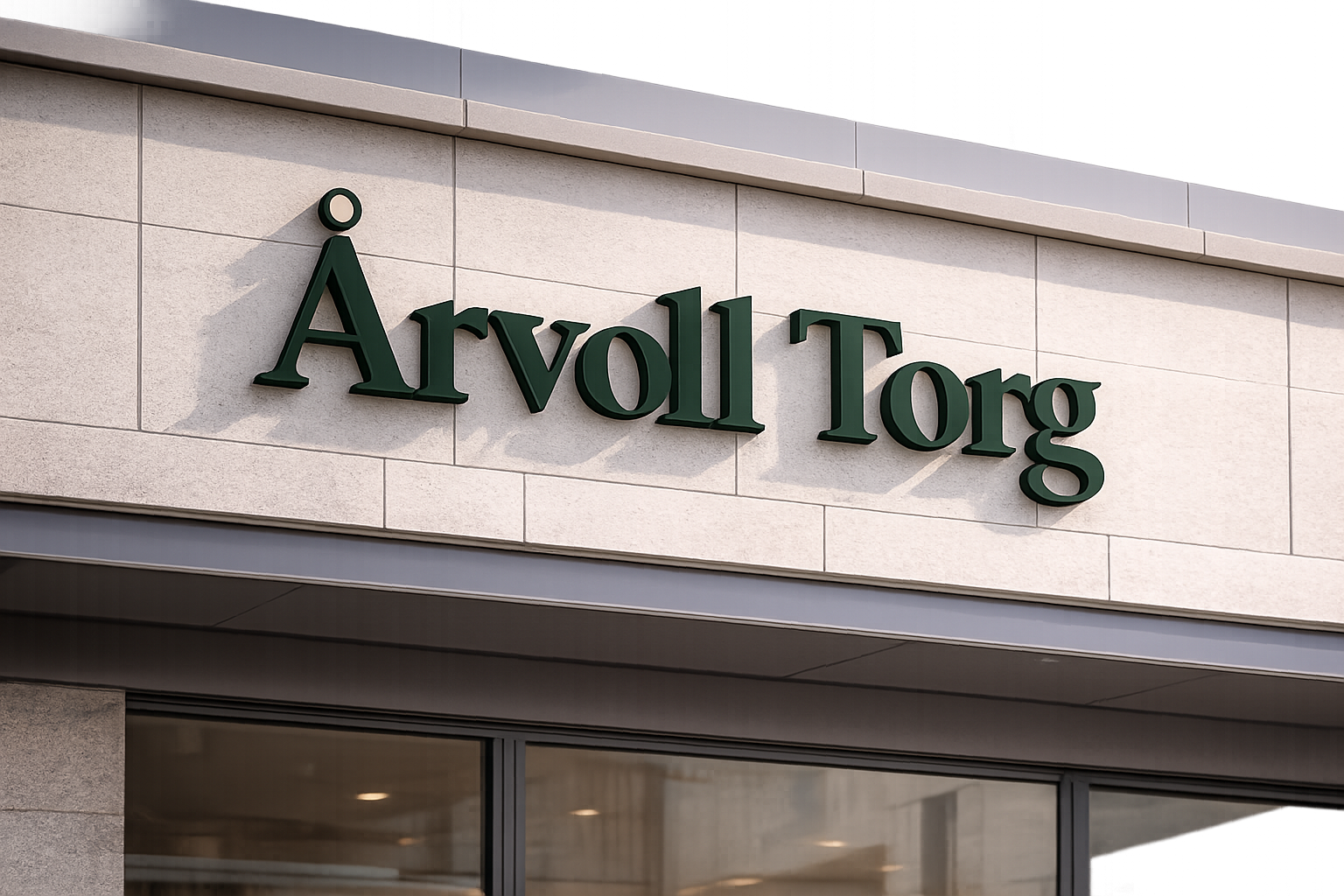 Årvoll Torg-skilt montert på fasaden over inngangspartiet